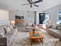 Virtually staged living room featuring neutral tones and modern furniture at 5211 Blue Lagoon Ln, Raleigh, NC 27610