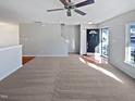 Spacious living room with neutral carpeting and a view of the entryway at 5211 Blue Lagoon Ln, Raleigh, NC 27610