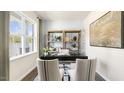 Home office with a desk, wooden shelves, and large window at 70 Saddle Mare St, Clayton, NC 27520