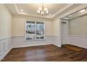 Bright dining room with hardwood floors and wainscoting at 88 Capewood Ct, Garner, NC 27529