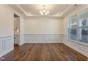 Spacious dining room featuring hardwood floors and chair rail at 88 Capewood Ct, Garner, NC 27529