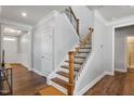 Elegant staircase with wrought iron railing and hardwood steps at 88 Capewood Ct, Garner, NC 27529