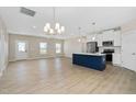 Open-concept living room and kitchen with stainless steel appliances, modern cabinets, and a center island at 1820 Johnson Rd, Burlington, NC 27217
