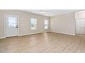 Bright and airy living room with a view of the entry door and natural light at 1820 Johnson Rd, Burlington, NC 27217