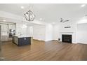 Open concept kitchen and living area with island and fireplace at 2029 Maggie Valley Dr, Apex, NC 27502