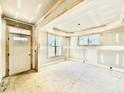 Spacious living room with large windows, wood trim and natural light at 2628 Silver Gate Ct, Wake Forest, NC 27587