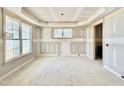 Living room featuring large windows and natural lighting at 2628 Silver Gate Ct, Wake Forest, NC 27587