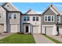 Charming new construction homes with attached garages, varied siding, and well manicured lawns at 545 Eversden Dr, Zebulon, NC 27597