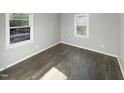 Bright bedroom with dark hardwood floors at 708 N Allen Rd, Wake Forest, NC 27587
