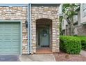 Stone-accented entryway with a welcoming door and landscaping at 201 Presque Isle Ln, Chapel Hill, NC 27514