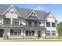 Charming modern farmhouse-style townhome featuring black window frames and a metal roof at 316 Church St, Morrisville, NC 27560