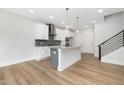 Bright, white kitchen offers a kitchen island and stainless steel appliances at 316 Church St, Morrisville, NC 27560