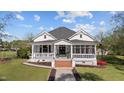 Beautiful home featuring a well-manicured lawn and a charming porch, creating excellent curb appeal at 400 S Boddie St, Nashville, NC 27856