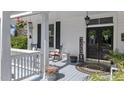 Relaxing front porch with comfortable seating, charming decor, and a welcoming atmosphere at 400 S Boddie St, Nashville, NC 27856