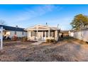 Charming home featuring a covered porch, neutral siding, and manicured landscaping at 408 W Main St, Pine Level, NC 27568