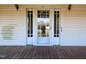Front entrance with glass storm door at 523 E Main St, Haw River, NC 27258