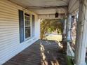 Wrap around porch with wooden flooring at 523 E Main St, Haw River, NC 27258