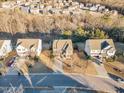 Neighborhood aerial view showcasing well-maintained homes, tree-lined streets, and community layout at 664 Long Melford Dr, Rolesville, NC 27571