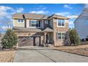 Beautiful two-story home boasting mixed siding, large windows, and a double garage, set on a spacious lot at 664 Long Melford Dr, Rolesville, NC 27571