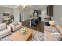 Virtually staged living room with kitchen view at 902 Laurel Gate Dr, Wake Forest, NC 27587