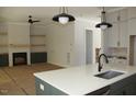 Spacious living room featuring a fireplace, custom built-ins, and a view to the kitchen at 1021 Smoke Willow Way # 130, Rolesville, NC 27571