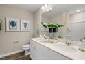 Main bathroom features a double vanity and updated shower at 104 Kobus Ct, Garner, NC 27529