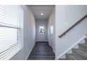 Bright hallway with wood-look floors, leading to other rooms at 1388 Fruit Cobbler Dr, Haw River, NC 27258