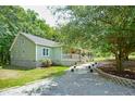 Green house with walkway and landscaping at 1610 Woodards Dairy Rd, Middlesex, NC 27557