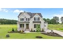 Beautifully landscaped two-story home with stone accents and a well-maintained lawn at 190 Broadleaf Ln, Youngsville, NC 27596