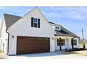 Attractive exterior of new build home with dark roof and green lawn at 24 Surles Landing Way, Benson, NC 27504