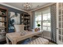 Bright office features built-in shelves and a large window at 2940 Hanging Valley Way, Wake Forest, NC 27587