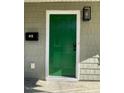 Green front door with black light fixture at 415 Sowell St, Durham, NC 27701