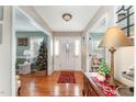 Bright foyer featuring hardwood floors, a Christmas tree, and an entryway with ample natural light at 575 Crystal Spring Dr, Sanford, NC 27332