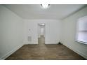Bright living room featuring hardwood floors and neutral walls at 645 Arch St, Henderson, NC 27536