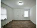 Simple living room with hardwood floors and neutral walls at 645 Arch St, Henderson, NC 27536