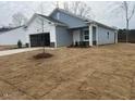 New construction home with attached garage and front yard at 7335 Pilatus Ave, Spring Hope, NC 27882