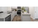 Modern kitchen with granite countertops and stainless steel appliances at 8630 Brixton Shay Dr, Raleigh, NC 27616