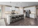 Island kitchen with granite countertops and white cabinets at 1024 Country Pasture Cv, Wendell, NC 27591