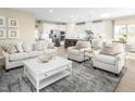 Open living room featuring neutral tones and ample natural light at 1024 Country Pasture Cv, Wendell, NC 27591