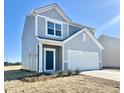 Two-story house with gray siding, white garage door, and landscaping at 1125 Centerview Drive, Nashville, NC 27856