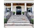 Inviting entryway features a stone staircase leading to the front door at 120 Crosby Ln, Sanford, NC 27330