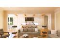 Open concept kitchen and living area with modern appliances and island at 1521 Canterbury Rd, Raleigh, NC 27608