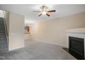 Living room with fireplace, stairs, and kitchen view at 1673 Snowmass Way, Durham, NC 27713