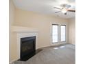 Living room features a fireplace and access to a deck at 1673 Snowmass Way, Durham, NC 27713