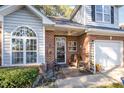 Brick front porch with seating area, creating a welcoming entryway at 2112 White Pond Ct, Apex, NC 27523