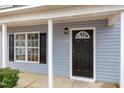 Black front door with sidelights and a window above at 2862 Filbert St, Raleigh, NC 27610
