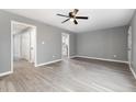 Spacious living room with gray walls and wood-look flooring at 2862 Filbert St, Raleigh, NC 27610