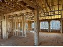Open floor plan, under construction, with large windows at 30 Seahawk Way, Zebulon, NC 27597