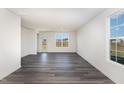 Spacious living room with gray vinyl plank flooring and lots of natural light at 339 Suhani Ln, Clayton, NC 27520