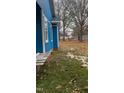 Blue house with a side yard and mature trees at 509 Atlantic Ave, Rocky Mount, NC 27801